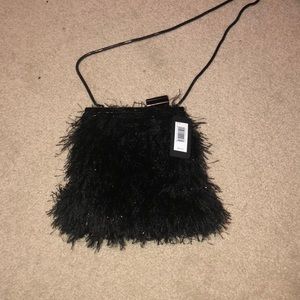 Black feathery clutch